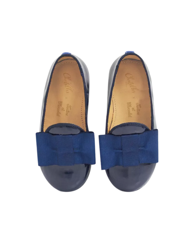 Varnished leather mini slippers with grosgrain bow 