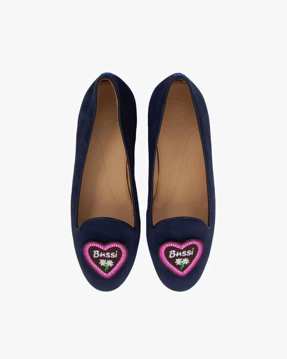 Navy blue suede slippers with a heart patch reading "Bussi" (kiss in German)