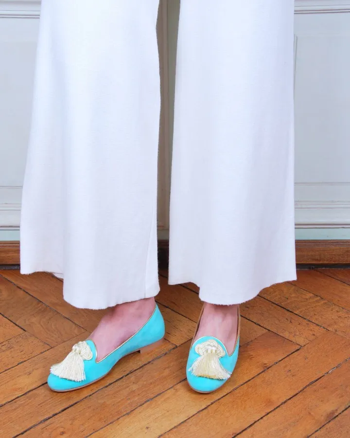 Pastel mint suede Slippers worn by a woman from side to side indoors
