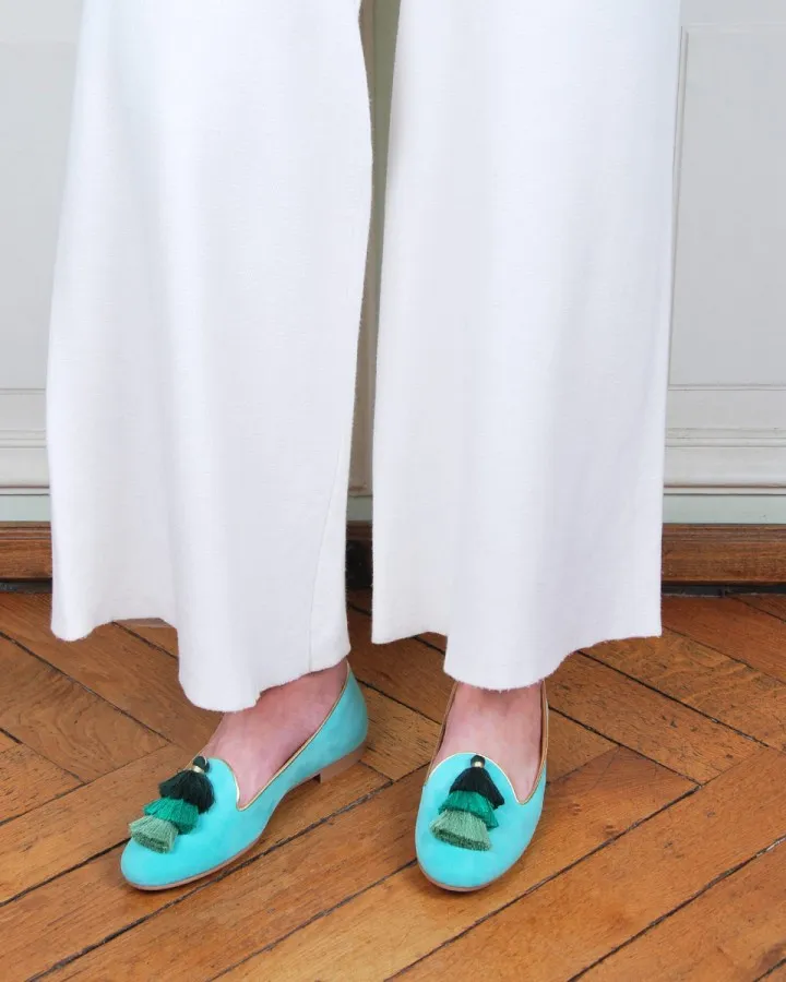 Pastel mint suede Slippers worn by a woman from side to side indoors