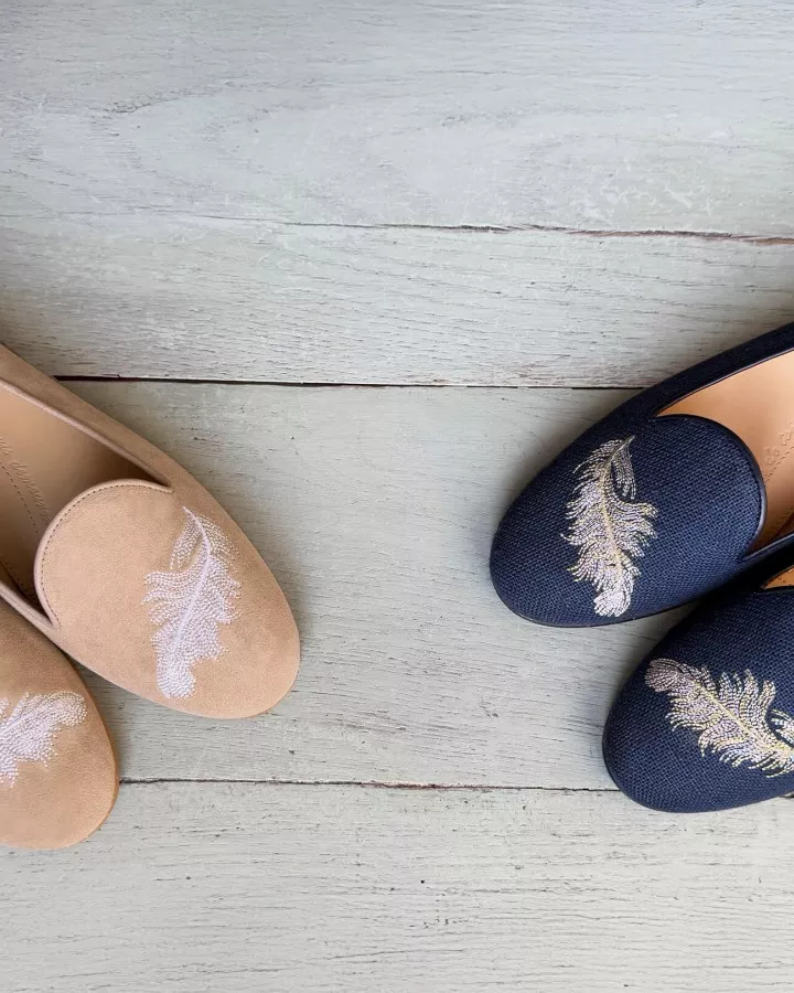 Navy suede slippers embroidered with a white & light gold feather