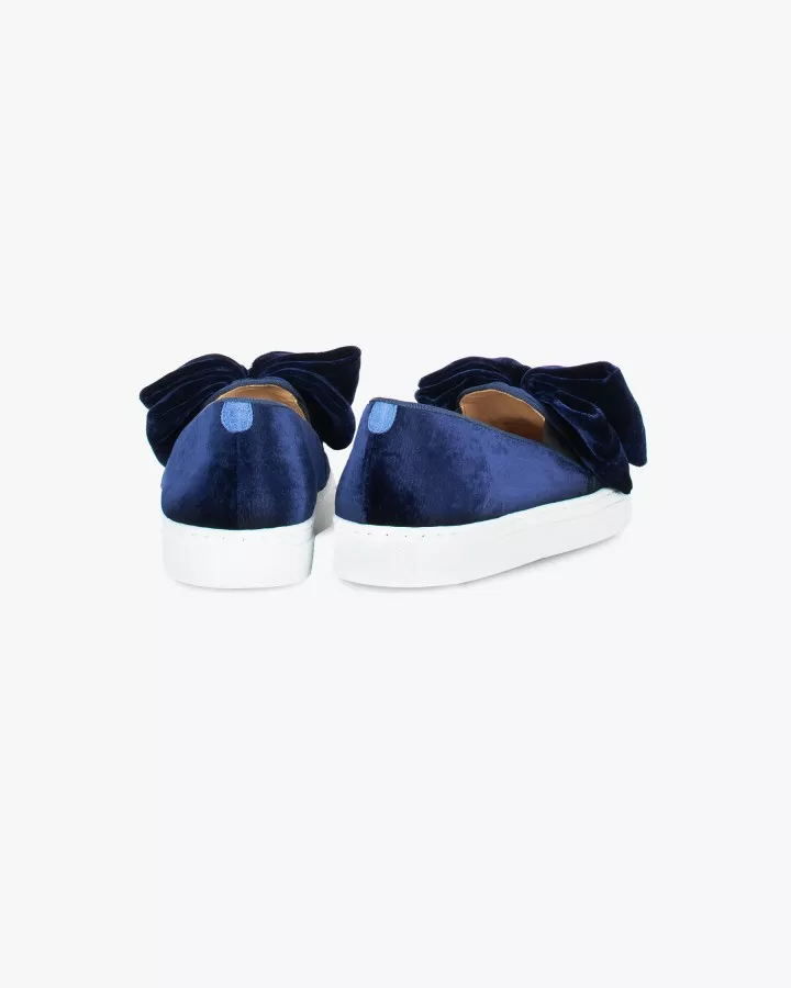 Navy blue velvet slip-ons with oversized bow