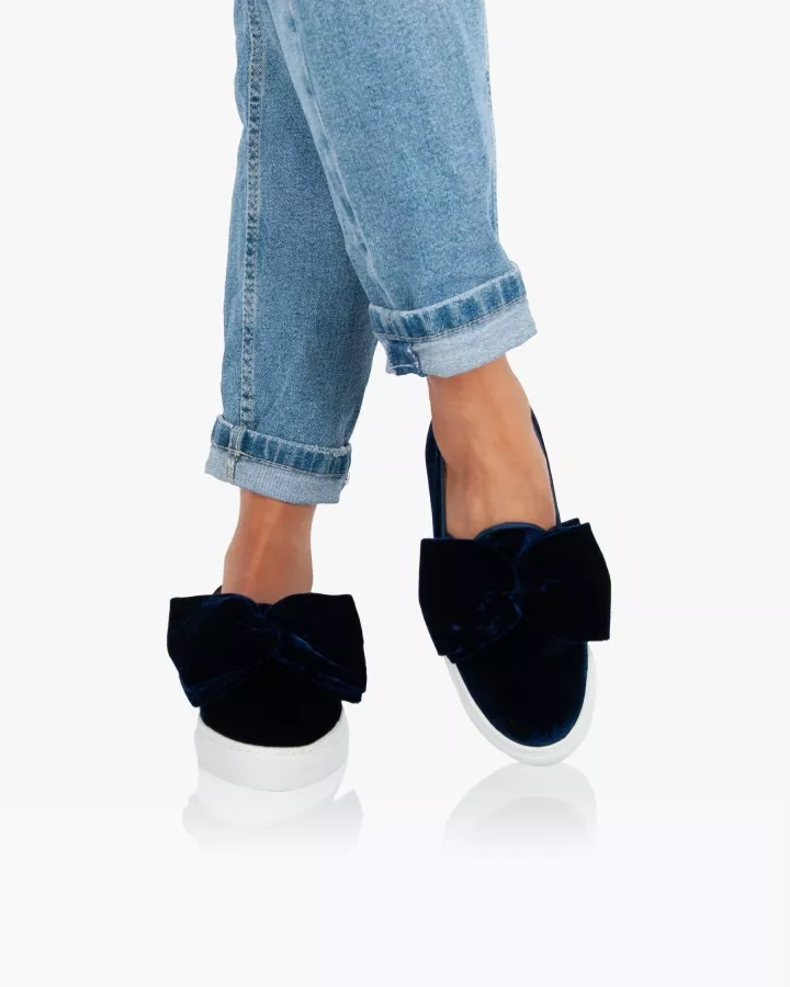 Navy blue velvet slip-ons with oversized bow