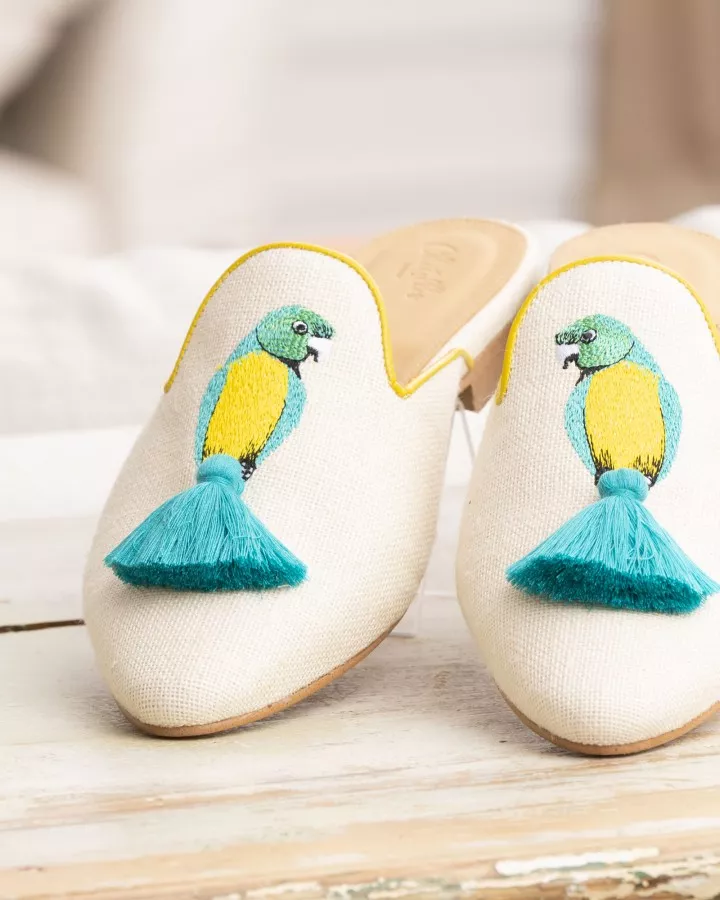 Beige canvas mules with blue and yellow embroideries