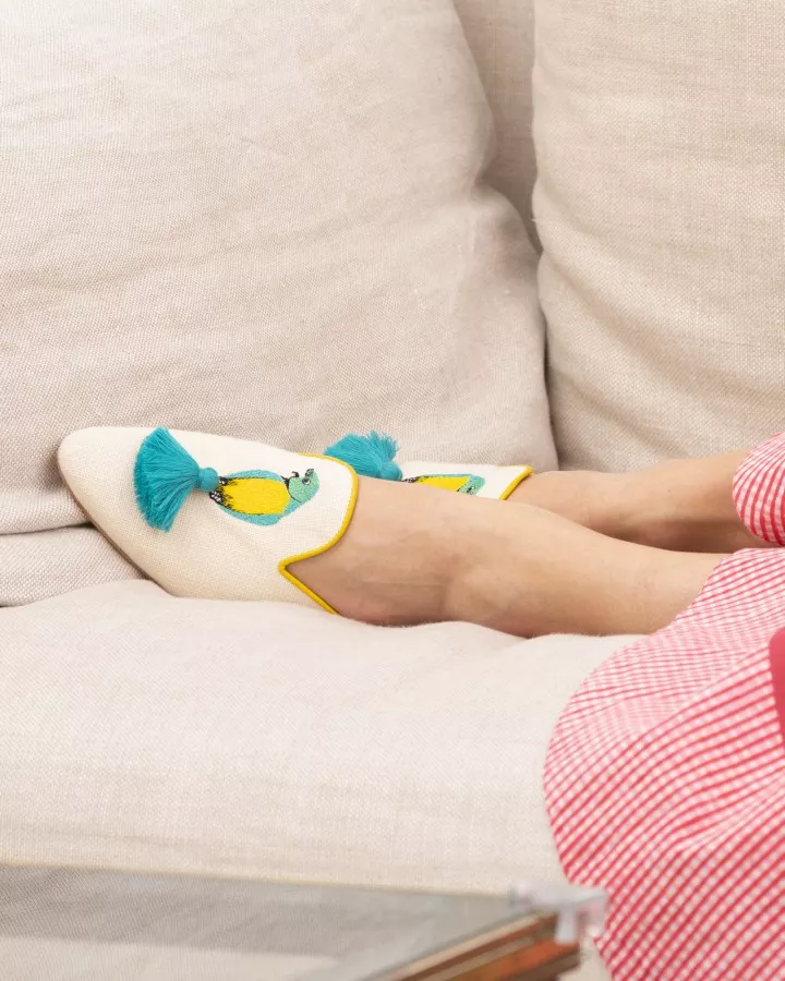 Beige canvas mules with blue and yellow embroideries